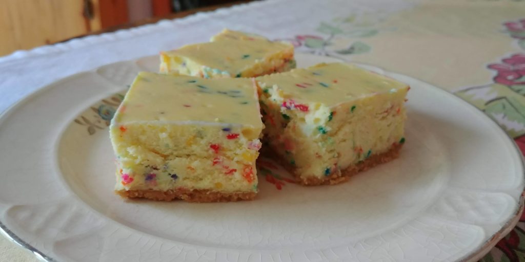 Funfetti Cheesecake Bars complete in squares