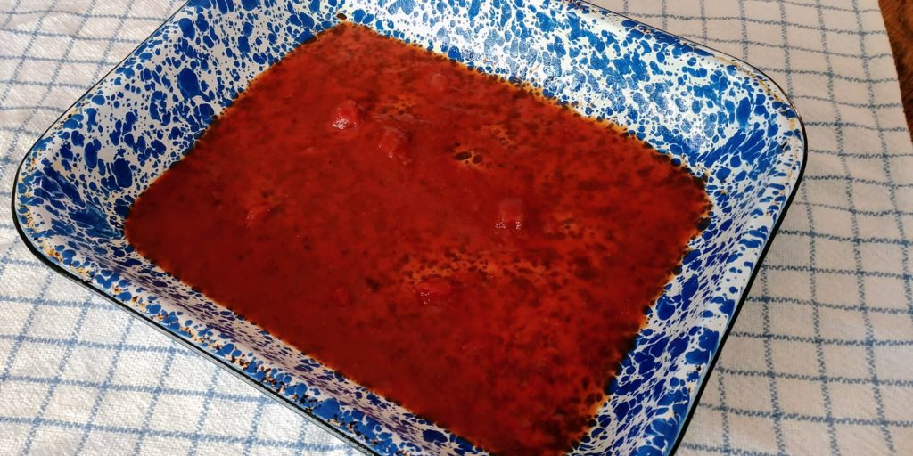 Ravioli Lasagna sauce in pan
