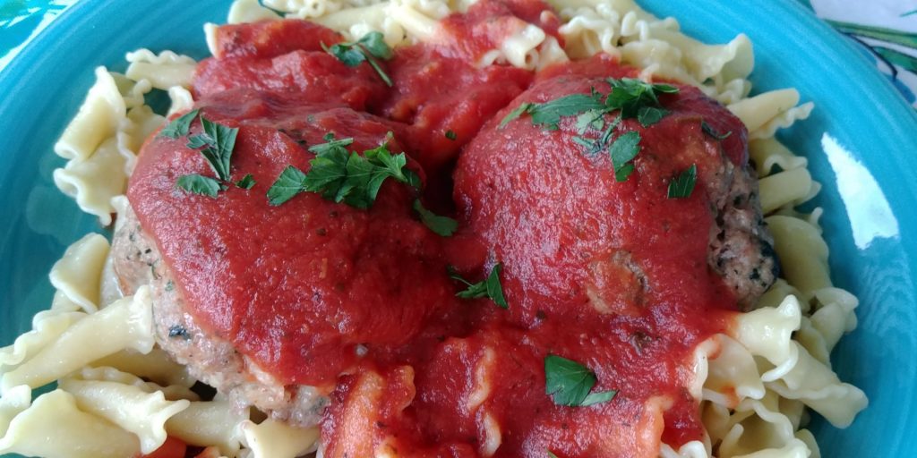 umbo Turkey Meatballs complete on pasta with red sauce