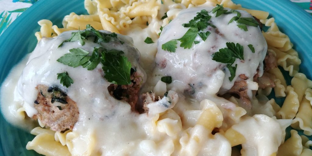 Jumbo Turkey Meatballs complete on pasta with white sauce