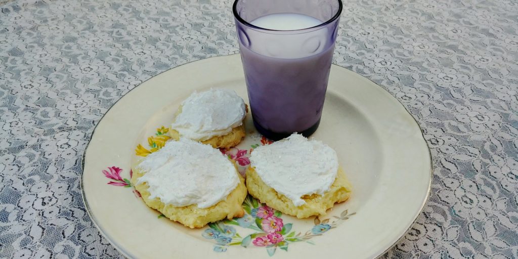 Wedding Cake Cookies complete on plate with milk