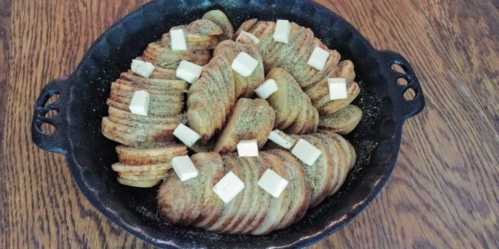 Baked Italian Potatoes in pan with seasonings unbaked