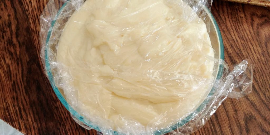 Vanilla Custard Filling for Cream Puffs complete in bowl with plastic wrap