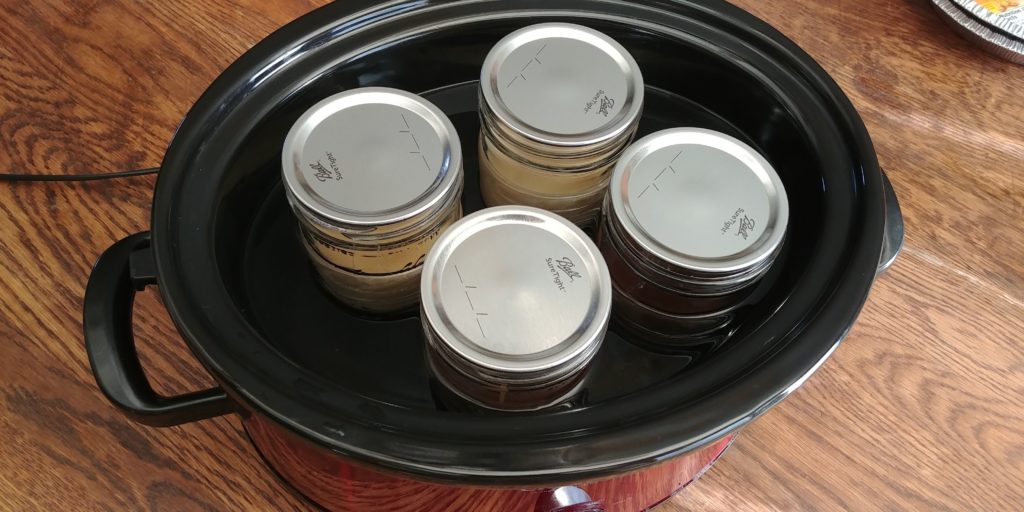 Caramel Pie jars in crockpot with flats