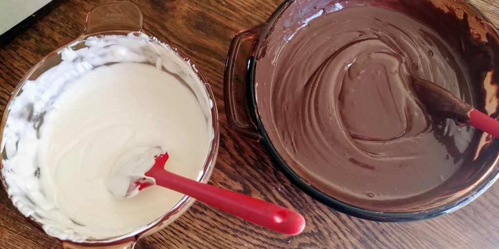 The Best Peanut Butter BonBons coating melted in bowls