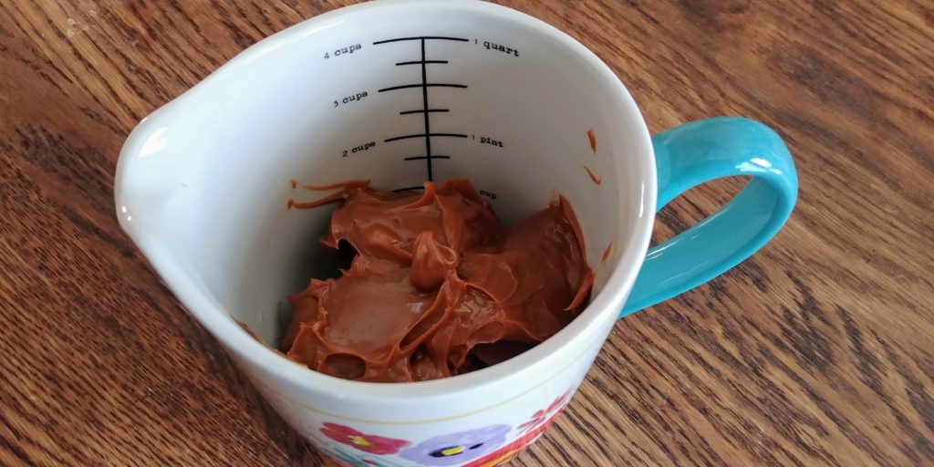 DulceDelish Brownies dulce in measuring cup