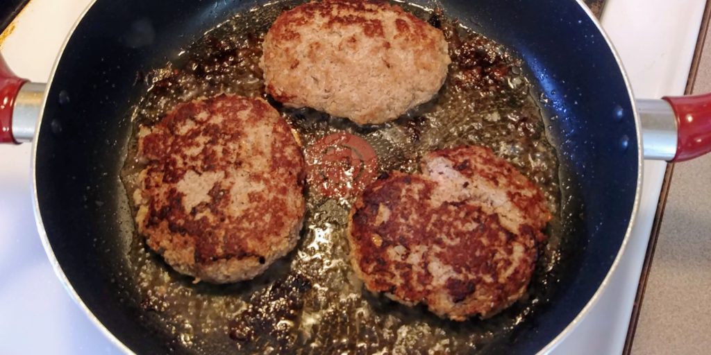 Perfect Turkey Burgers patties in skillet after flipping
